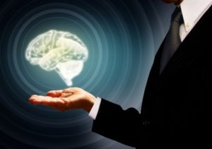 businessman-holding-a-brain-in-the-palm--skills-concept--conce